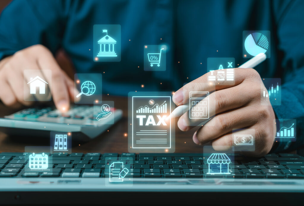 businessman calculates taxes using calculator computer budgeting tax calculation