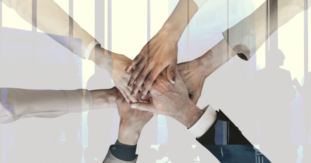 Powering On Through Trying Times 11 teamwork partnership corporate business concept scaled e1788944925625