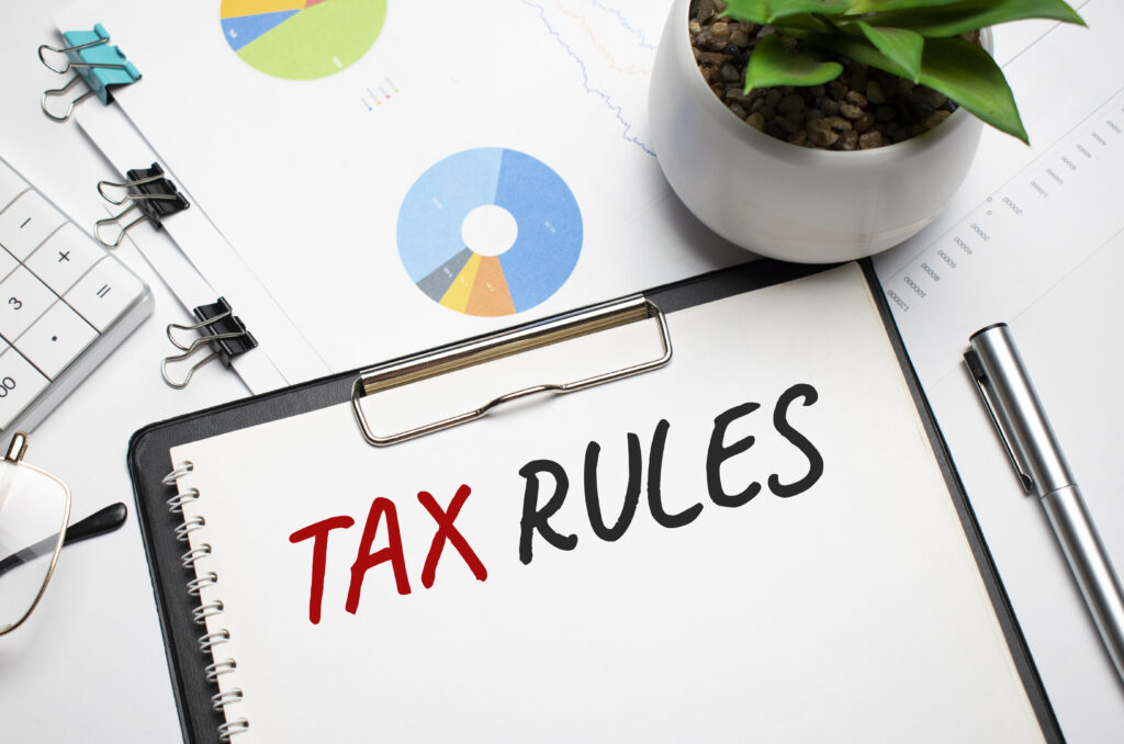 paper with tax rules table calculator money