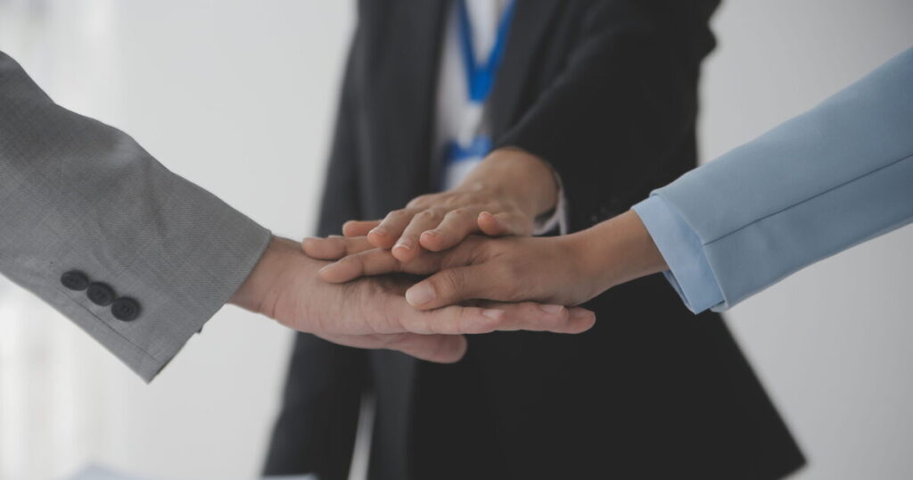 group businesspeople investors meet discuss market s success past quarter idea setting up marketing consulting team working together as team made it success scaled e1788943719382