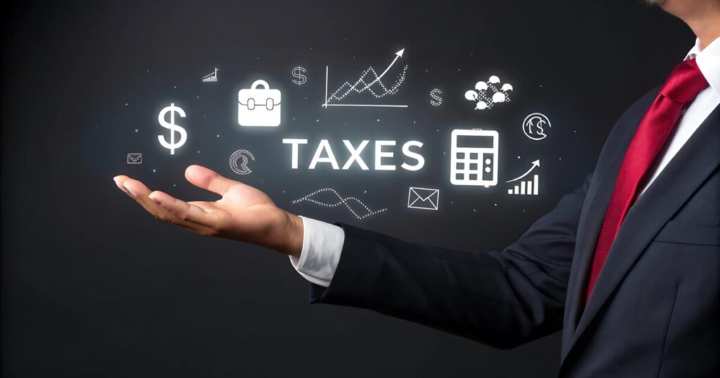 hand holds sign that says tax it scaled e1788939523888