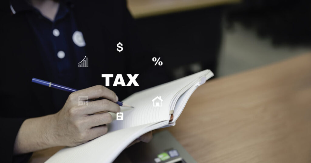 concept taxes paid by individualstax with person using laptop desk scaled e1788939118615
